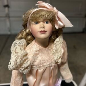 Elegant Porcelain Doll with Pink Dress and Lace Details